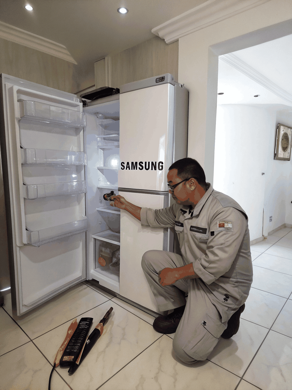 Certified technician servicing a premium KitchenAid kitchen suite